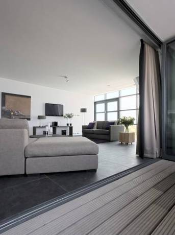 Imagen de la habitación del Hotel Poort Beach Apartments. Foto 13