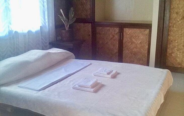 Imagen de la habitación del Hotel Port Barton Le Cou De Tou Village Resort. Foto 14