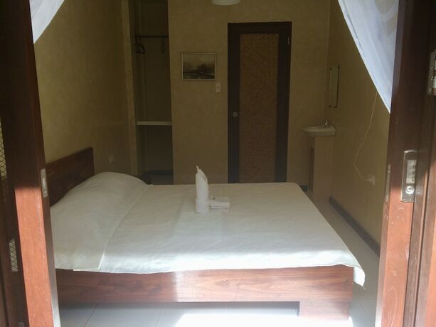 Imagen de la habitación del Hotel Port Barton Le Cou De Tou Village Resort. Foto 17