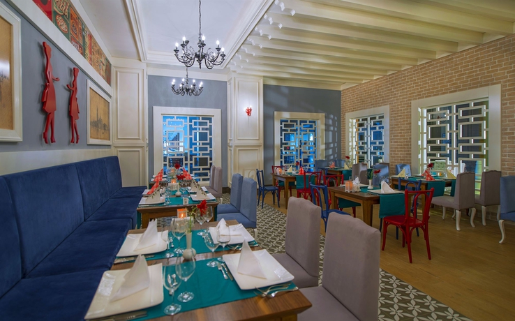 Imagen del bar/restaurante del Hotel Port Nature Luxury Resort and Spa – All Inclusive. Foto 3