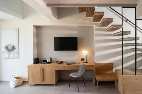 Imagen de la habitación del Hotel Portes Lithos Luxury Resort. Foto 9