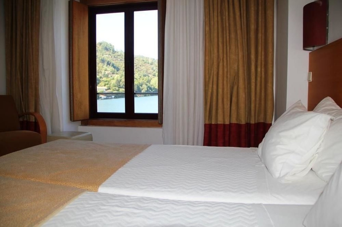 Imagen de la habitación del Hotel Porto Antigo. Foto 10