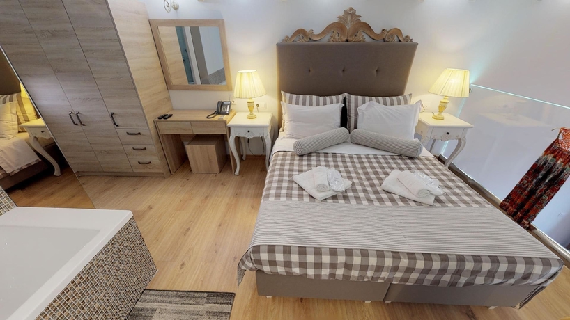 Imagen de la habitación del Hotel Porto Enetiko Suites. Foto 12