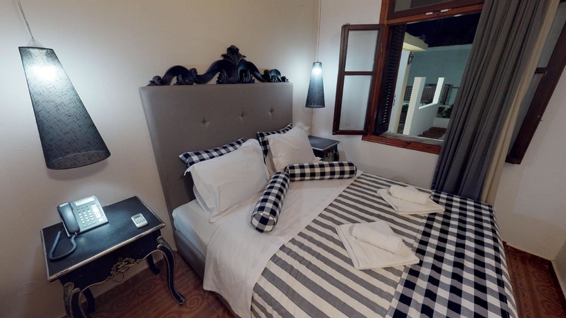 Imagen de la habitación del Hotel Porto Enetiko Suites. Foto 13