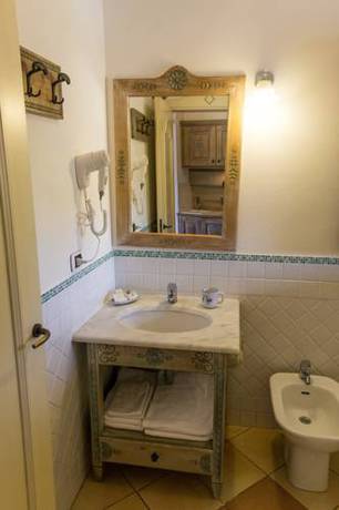 Imagen de la habitación del Hotel Porto Giunco Residence. Foto 8