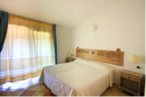 Imagen de la habitación del Hotel Porto Giunco Residence. Foto 9