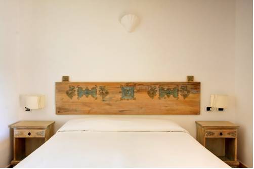 Imagen de la habitación del Hotel Porto Giunco Residence. Foto 15