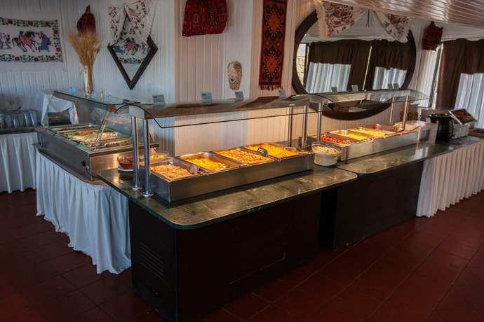 Imagen del bar/restaurante del Hotel Porto Greco Village Beach. Foto 8