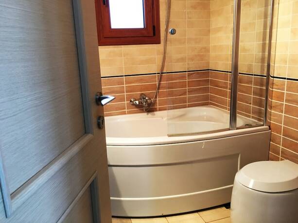 Imagen de la habitación del Hotel Porto Kalyves Seaside Apartments. Foto 13
