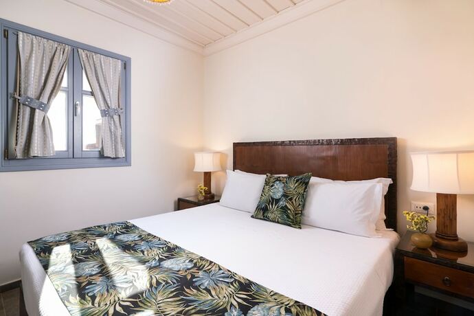 Imagen de la habitación del Hotel Porto Kea Suites. Foto 19