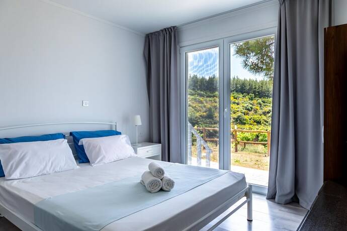 Imagen de la habitación del Hotel Porto Koufo Resort. Foto 17