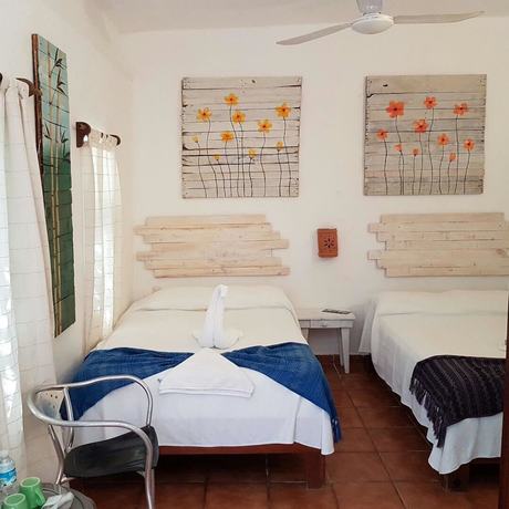 Imagen de la habitación del Hotel Posada Amor Boutique. Foto 17