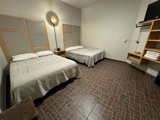 Imagen de la habitación del Hotel Posada Don Mario. Foto 9