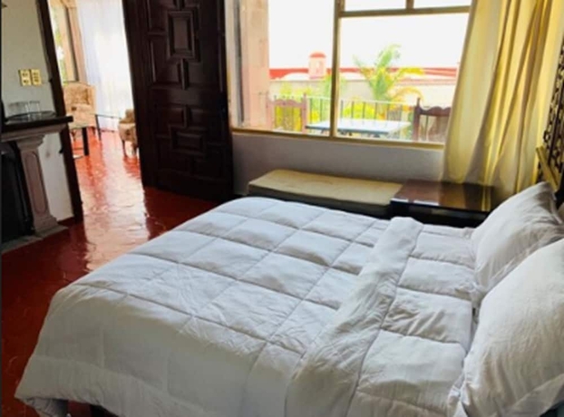 Imagen de la habitación del Hotel Posada La Ermita. Foto 14