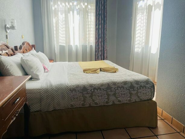 Imagen de la habitación del Hotel Posada La Fuente. Foto 12