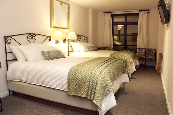 Imagen de la habitación del Hotel Posada Real De Chiapas. Foto 13