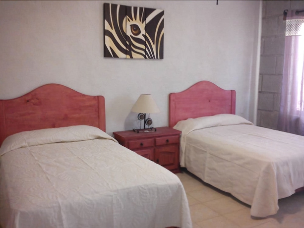 Imagen de la habitación del Hotel Posada Y Bungalows La Capilla. Foto 2