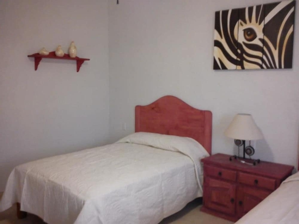 Imagen de la habitación del Hotel Posada Y Bungalows La Capilla. Foto 5