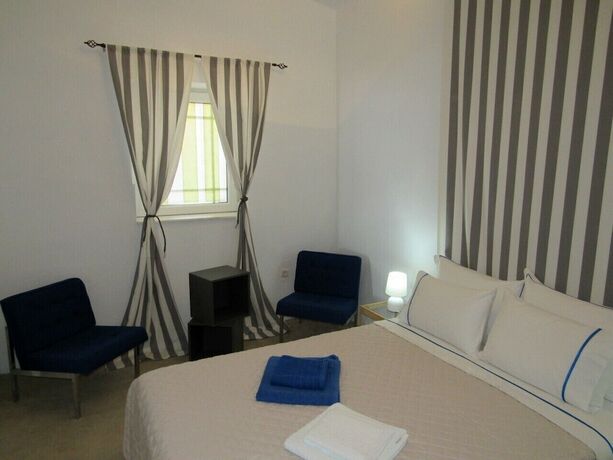 Imagen de la habitación del Hotel Poseidon Beach Villas. Foto 19