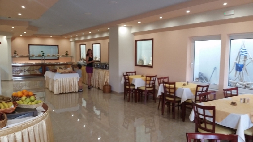Imagen del bar/restaurante del Hotel Poseidonia Apartments. Foto 4