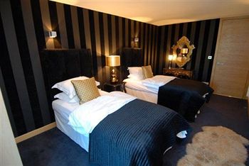 Imagen de la habitación del Hotel Posh Pads At The Casartelli. Foto 4