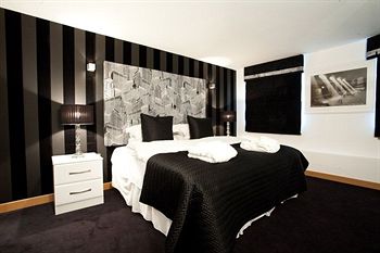 Imagen de la habitación del Hotel Posh Pads At The Casartelli. Foto 9