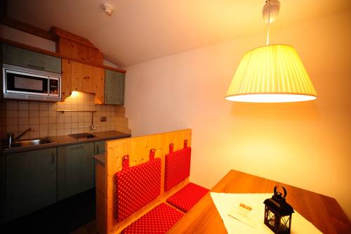 Imagen de la habitación del Hotel Post Alpina - Family Mountain Chalets, Dolomiti di Sesto - Alta Pusteria. Foto 8