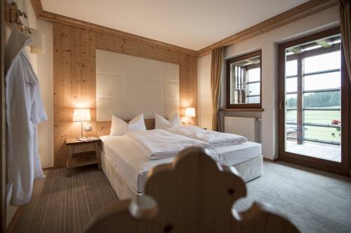 Imagen de la habitación del Hotel Post Alpina - Family Mountain Chalets, Dolomiti di Sesto - Alta Pusteria. Foto 10