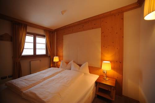 Imagen de la habitación del Hotel Post Alpina - Family Mountain Chalets, Dolomiti di Sesto - Alta Pusteria. Foto 11