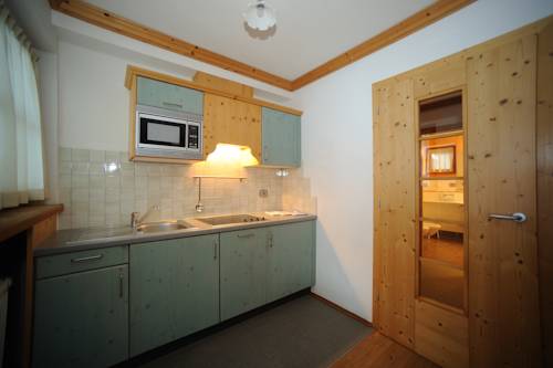 Imagen de la habitación del Hotel Post Alpina - Family Mountain Chalets, Dolomiti di Sesto - Alta Pusteria. Foto 13