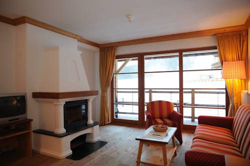 Imagen de la habitación del Hotel Post Alpina - Family Mountain Chalets, Dolomiti di Sesto - Alta Pusteria. Foto 14