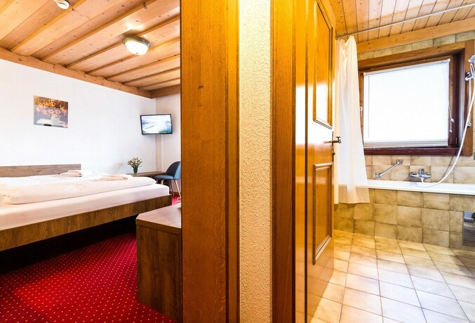 Imagen de la habitación del Hotel Post Fusch. Foto 12
