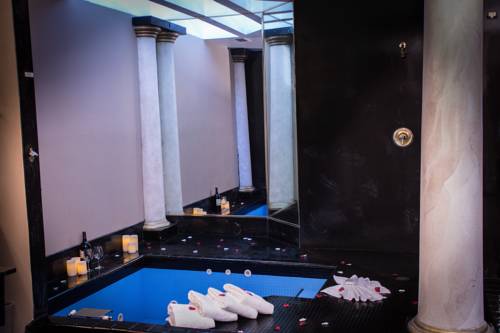 Imagen de la habitación del Hotel Postmarc and Spa Suites. Foto 8