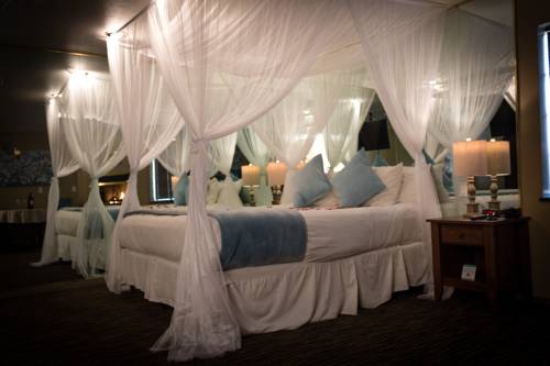 Imagen de la habitación del Hotel Postmarc and Spa Suites. Foto 11