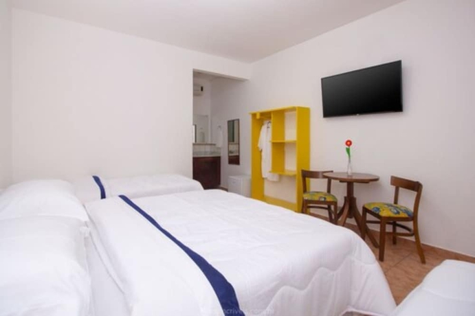 Imagen de la habitación del Hotel Pousada Aconchego. Foto 2
