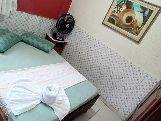 Imagen de la habitación del Hotel Pousada Aconchego Recanto Canto do Mar. Foto 17