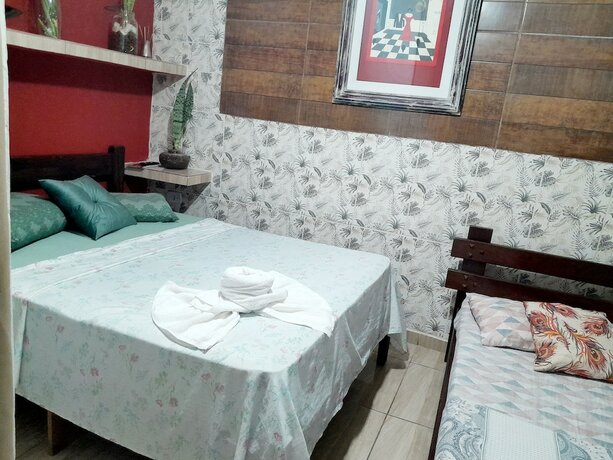 Imagen de la habitación del Hotel Pousada Aconchego Recanto Canto do Mar. Foto 18