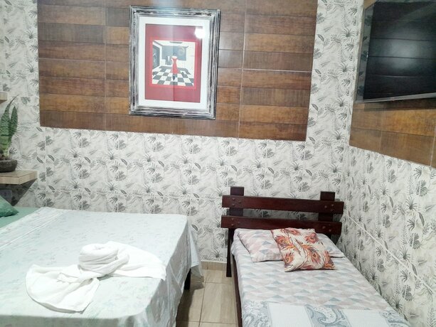 Imagen de la habitación del Hotel Pousada Aconchego Recanto Canto do Mar. Foto 20