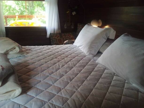 Imagen de la habitación del Hotel Pousada Alpes. Foto 20
