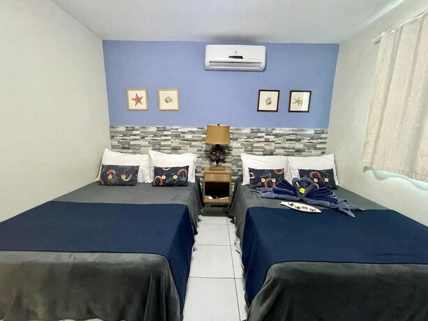 Imagen de la habitación del Hotel Pousada Beach House Coqueirinho. Foto 14