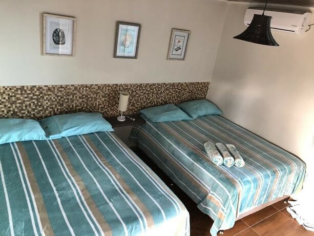 Imagen de la habitación del Hotel Pousada Beach House Coqueirinho. Foto 36