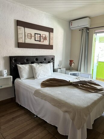 Imagen de la habitación del Hotel Pousada Caminho do Pontal. Foto 19