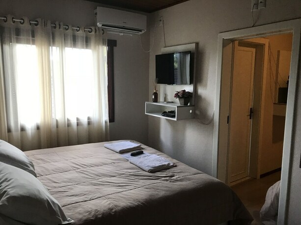 Imagen de la habitación del Hotel Pousada Cantinho Da Serra. Foto 18
