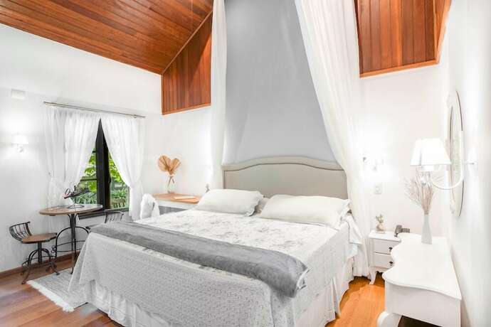 Imagen de la habitación del Hotel Pousada Cantos e Contos, Camanducaia. Foto 17