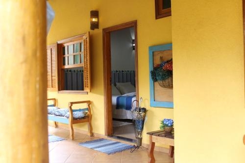 Imagen de la habitación del Hotel Pousada Chal&eacute; Das Flores. Foto 9