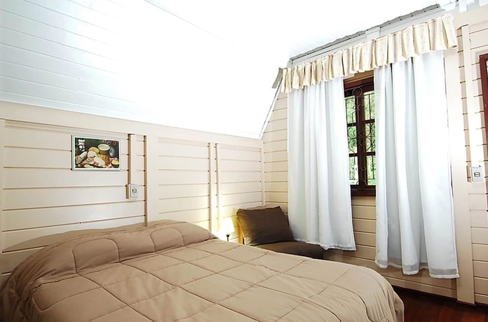 Imagen de la habitación del Hotel Pousada Das Flores, Gramado. Foto 8