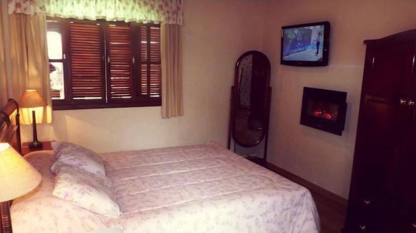 Imagen de la habitación del Hotel Pousada Das Rosas, Campos do Jordao. Foto 6
