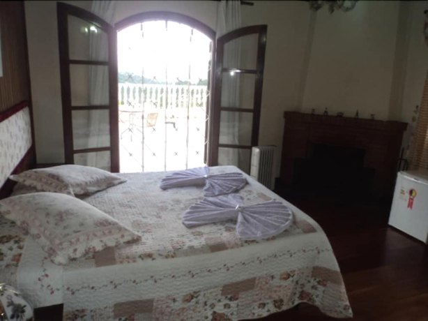 Imagen de la habitación del Hotel Pousada Das Rosas, Campos do Jordao. Foto 9