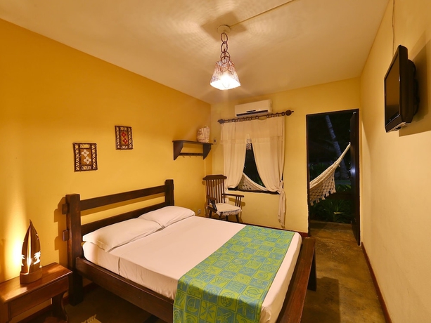 Imagen de la habitación del Hotel Pousada Dos Coqueiros. Foto 5