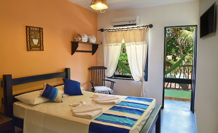 Imagen de la habitación del Hotel Pousada Dos Coqueiros. Foto 11